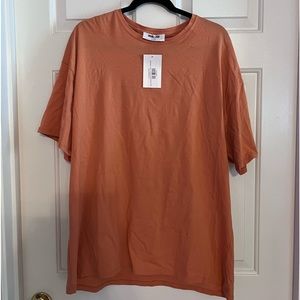 Orange oversized T-shirt by double zero and a size medium